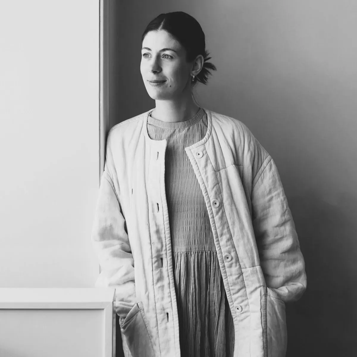 Designer Laura Lange portrait Hasle wall lamp series showcasing modernist lighting design for FDB Møbler