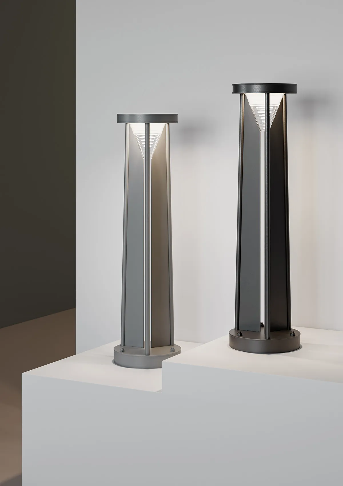 Triad luminaire close-up showing triangular construction and semi-transparent element.