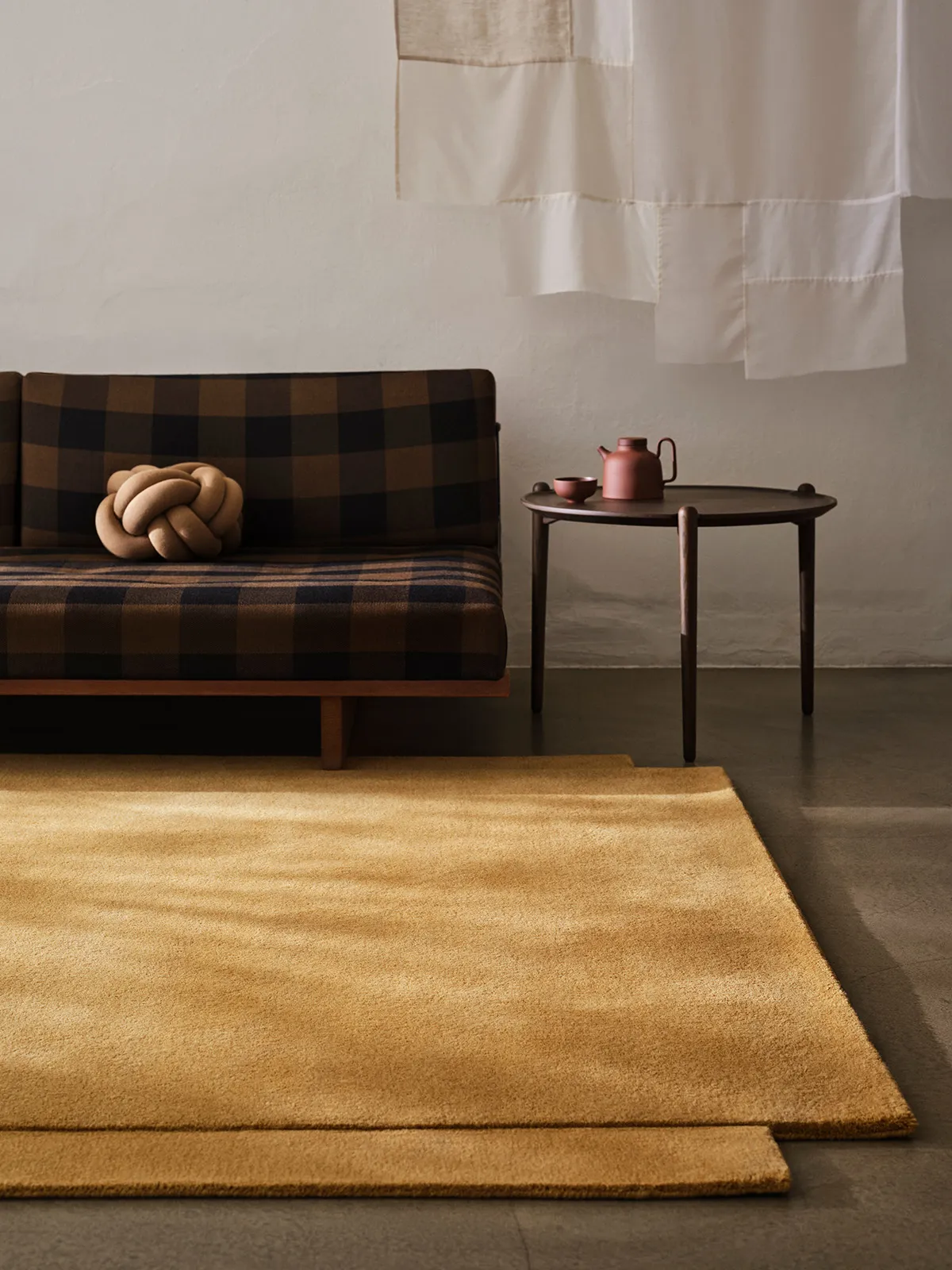 Level Rug in beige colorway displayed on a neutral surface highlighting its subtle texture and dimensional qualities.