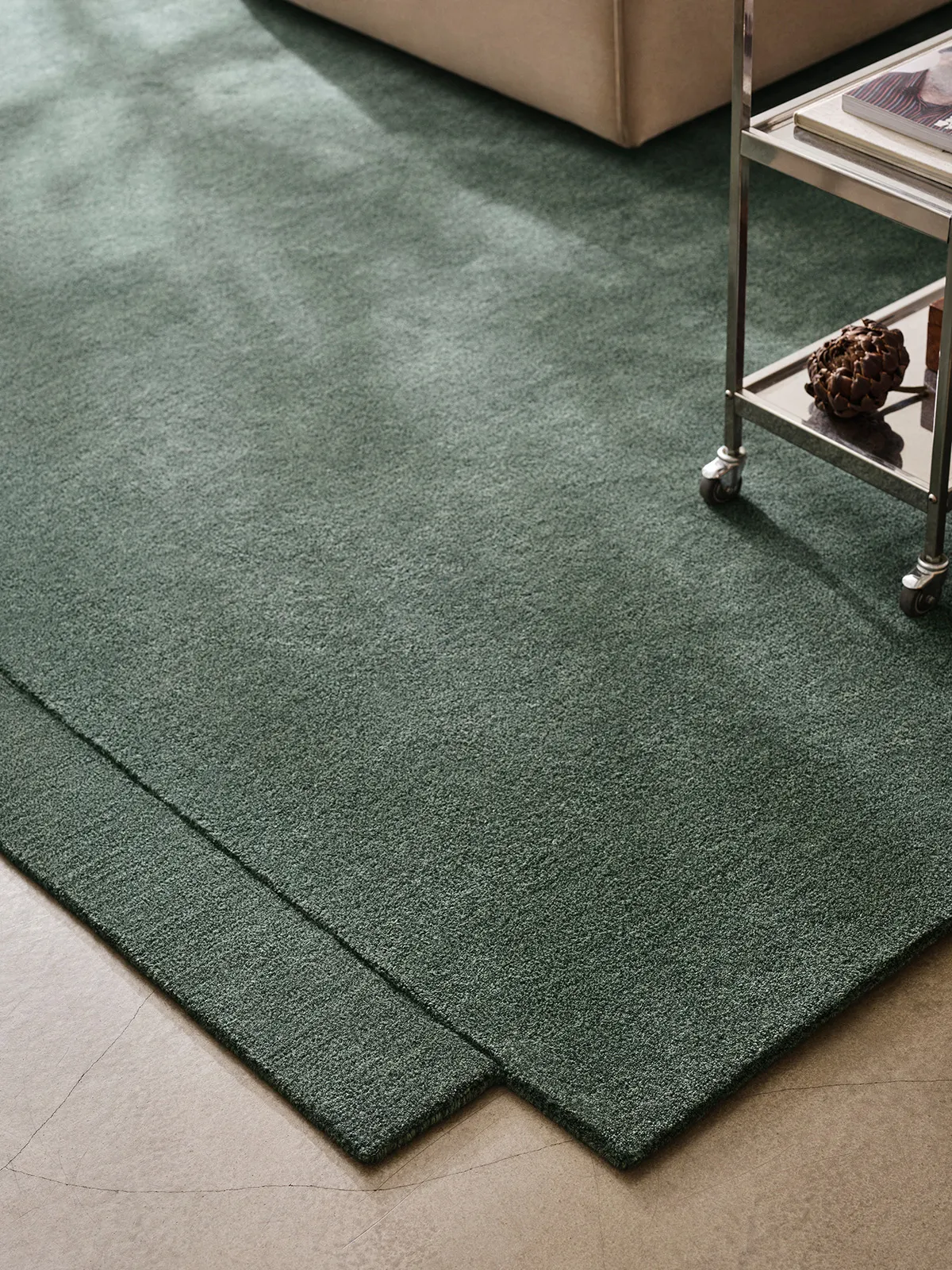 Close-up of Level Rug showing the intricate hand-tufted wool texture and the precise edge where the two layers meet.