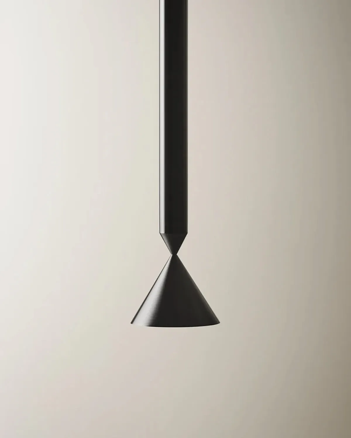 Apollo pendant lamp in matte black aluminum suspended over dining table, casting focused downlight with minimalist sculptural presence.