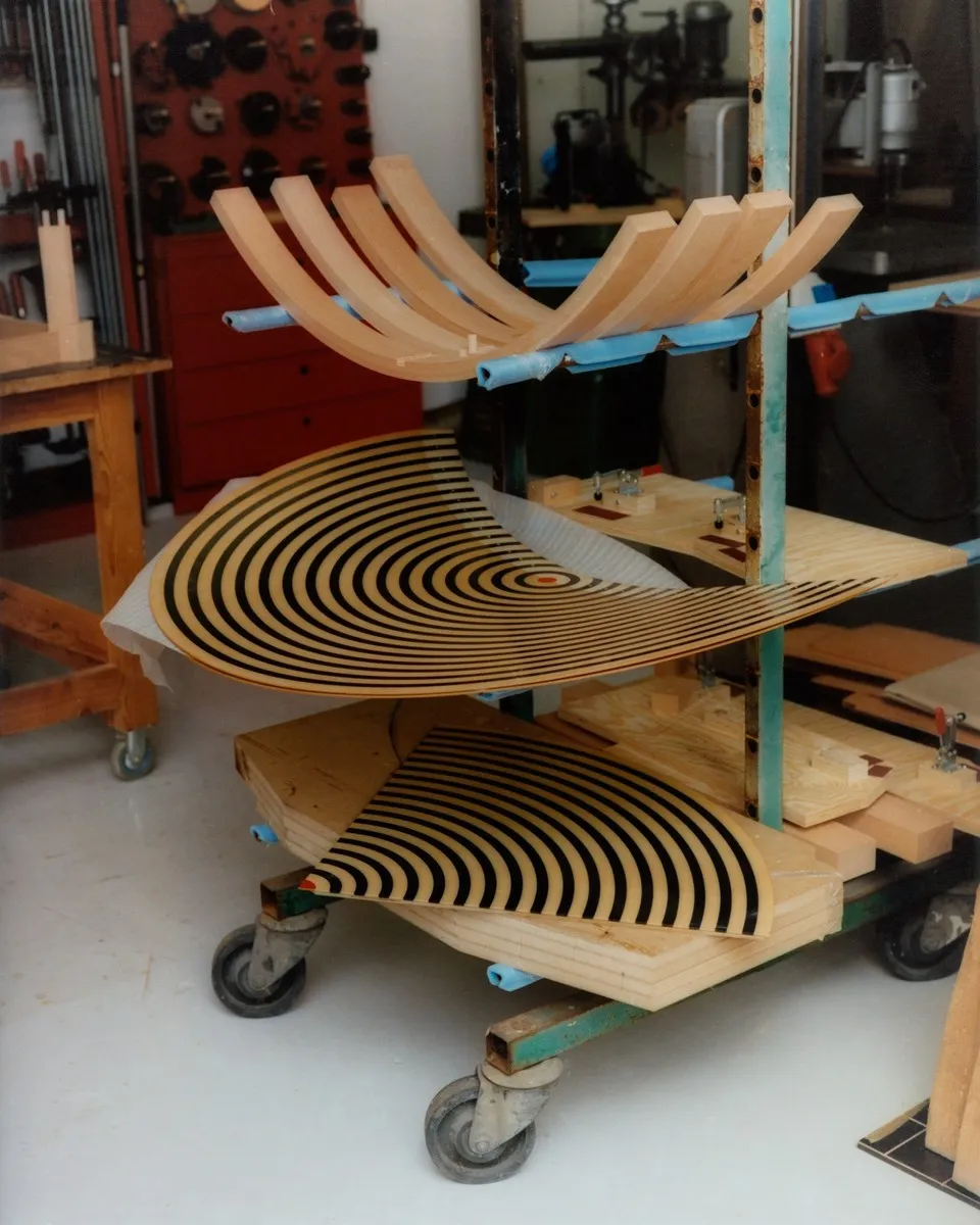 Danish workshop craftsmen assembling Nanna Ditzel bench using traditional woodworking techniques