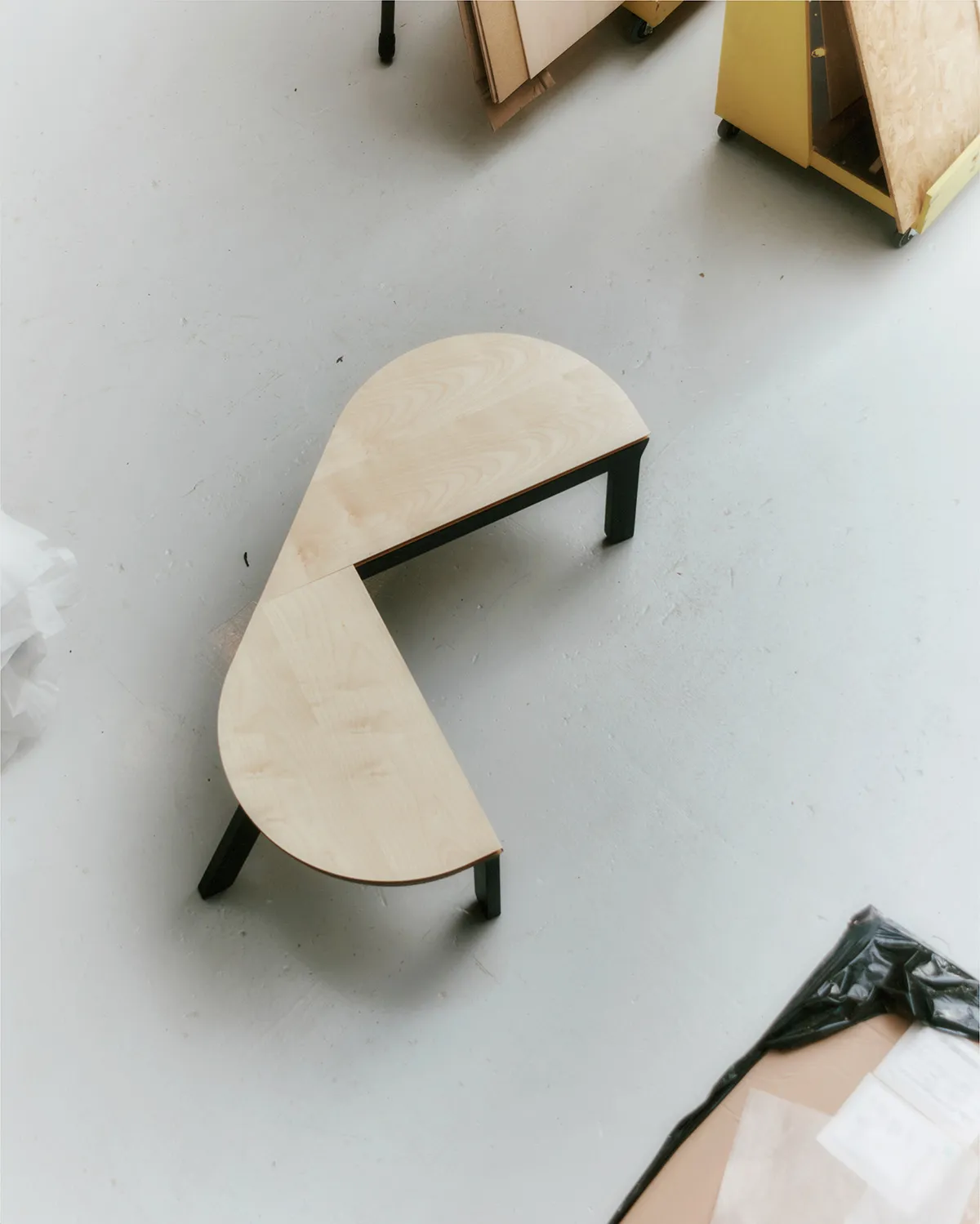 Danish workshop craftsmen assembling Nanna Ditzel bench using traditional woodworking techniques