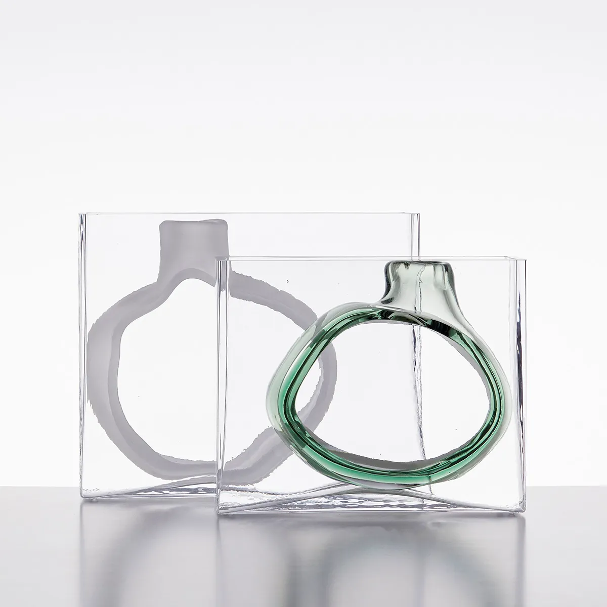 Swedish glass designer Matti Klenell portrait with his contemporary glass sculptures from 9 Factory Road series