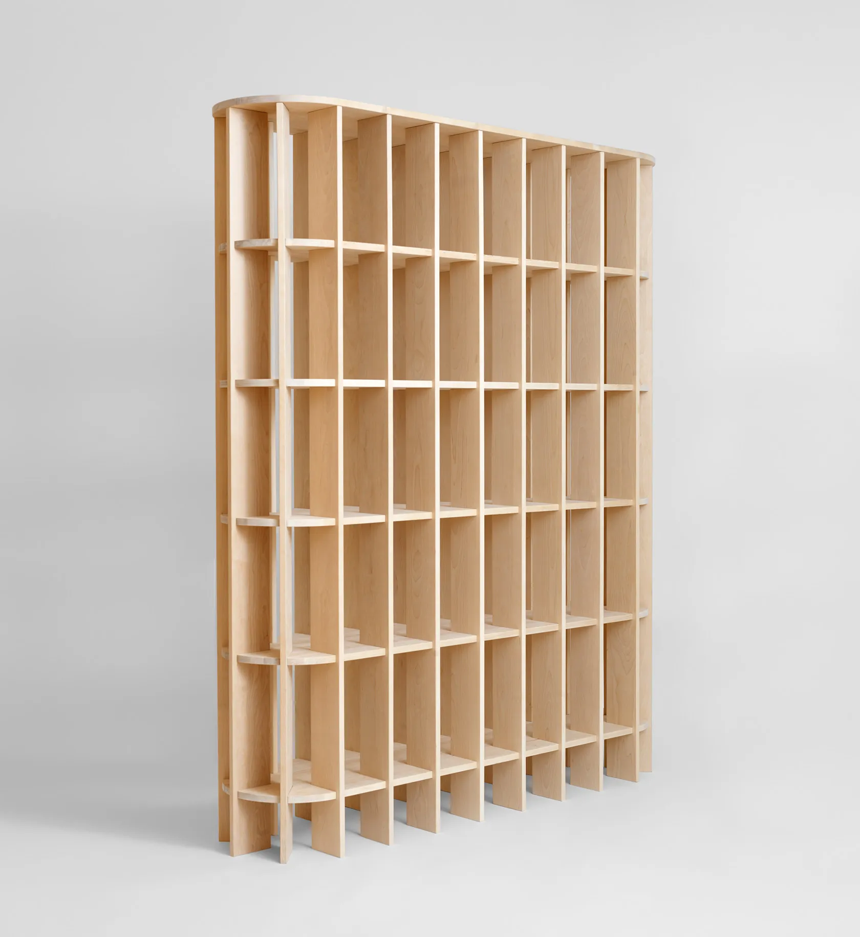 Room divider functionality of V.NA.01 shelf system separating living spaces with elegant design