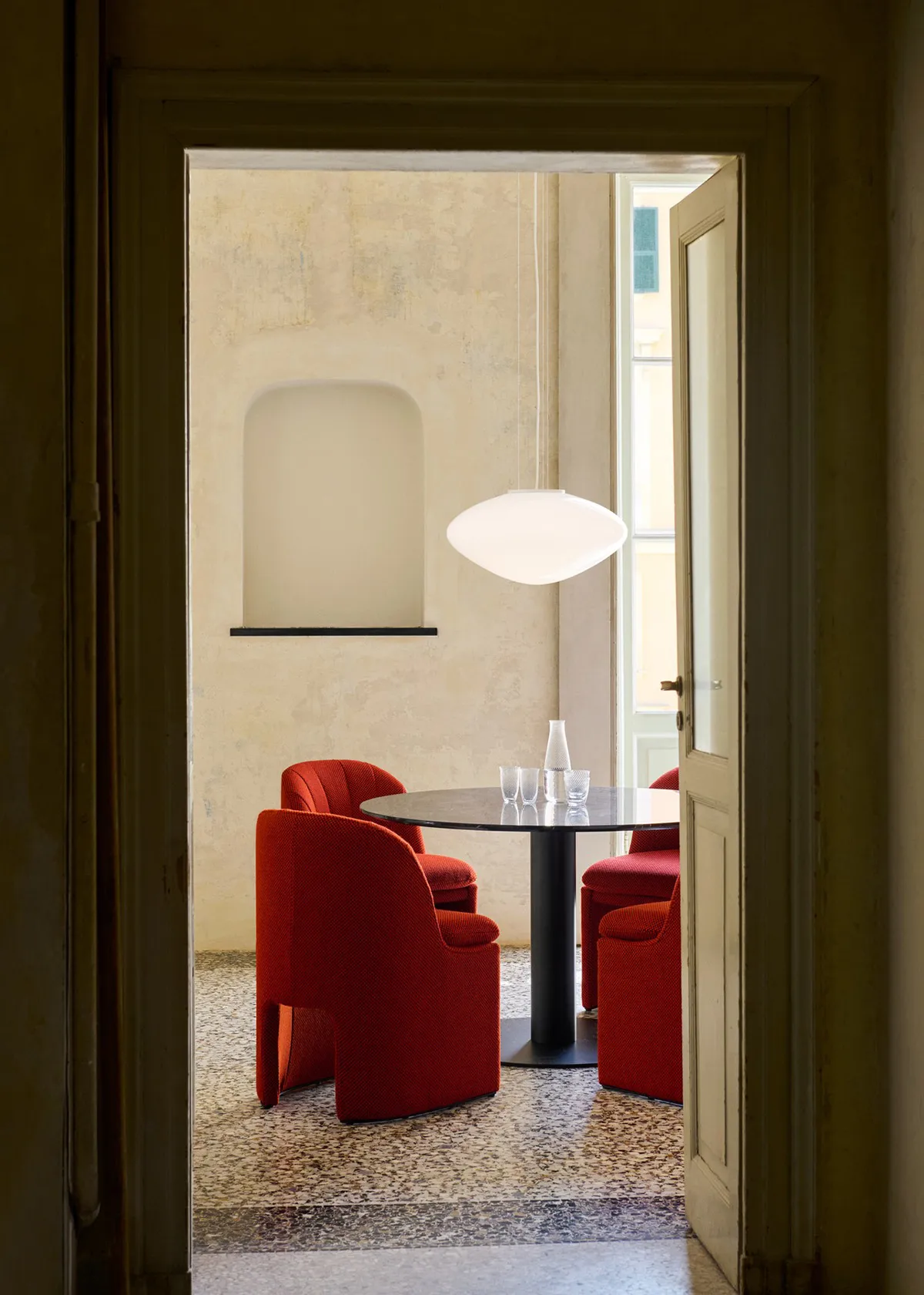 Loafer chairs arranged in contemporary dining setting demonstrating flexible seating configuration