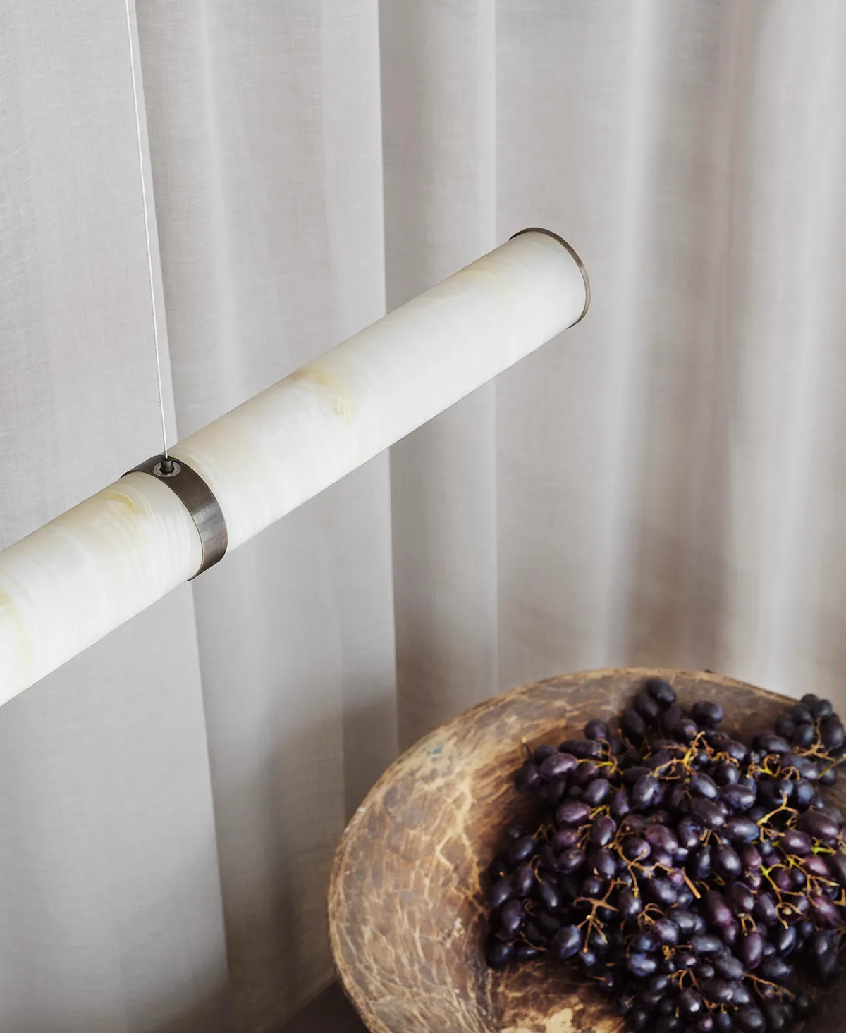 Close-up detail of natural onyx texture in PARS Collection showing stone's translucent qualities