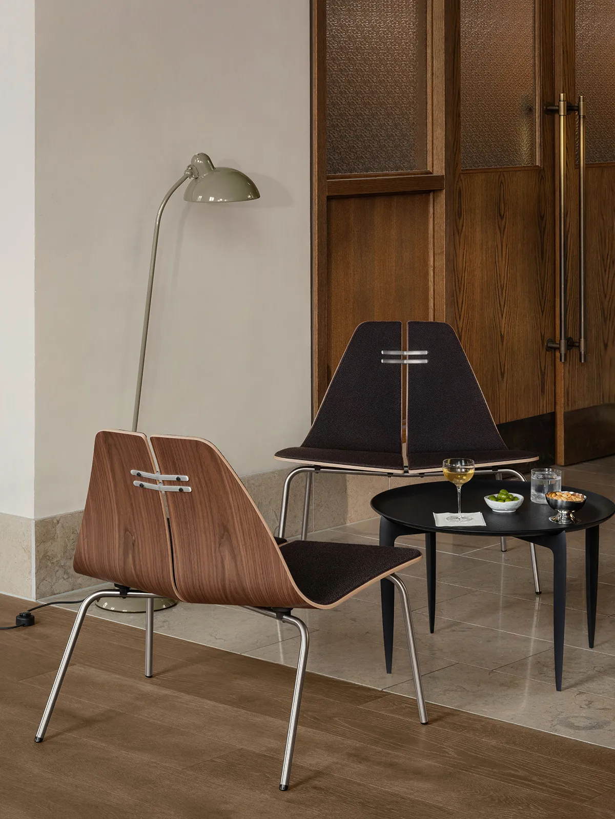 PK23 lounge chair by Poul Kjaerholm showing molded plywood construction and innovative double-shell design