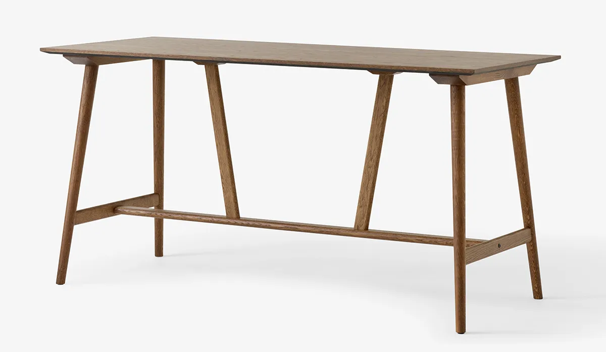 Side profile In Between counter table displaying minimalist elongated surface and architectural support system