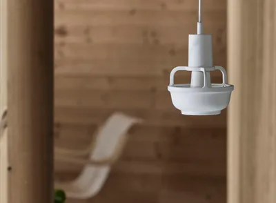 Kori lamp by TAF Studio for Artek featuring basket-inspired aluminum shade with direct indirect light