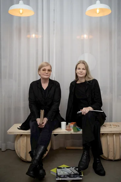 Nola's spatial exhibition stand at Stockholm Furniture Fair creating zones for relaxation and reflection amid trade show activity