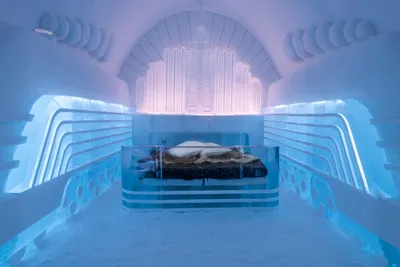 ICEHOTEL 35th anniversary edition featuring innovative ice and snow architecture with elaborate sculptural room designs