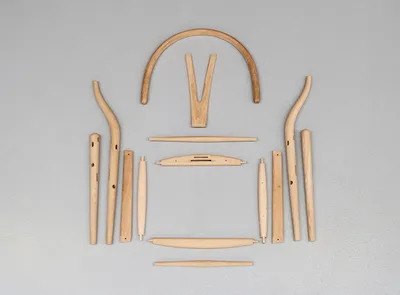 Carl Hansen & Søn authentic Wishbone Chair crafted with sustainable wood showcasing the iconic Y-shaped backrest and handwoven seat