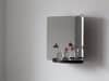 124° wall mirror by Daniel Rybakken for Artek featuring sculptural dual-aspect design in polished steel construction