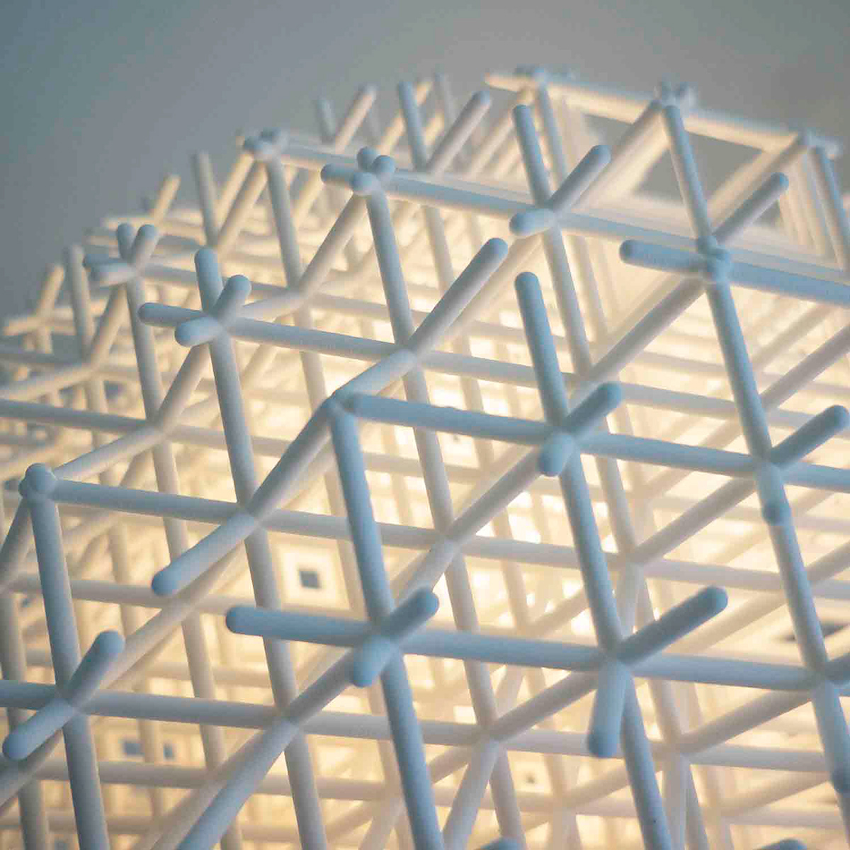 Lattice pendant by Charlotte von der Lancken, 3D-printed grid globe with moiré light effect