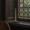 Holocene No. 6 brass candleholder by Ilse Crawford featuring concave disc design with central spike