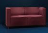Pauline Deltour stylized sofa collection by Offecct featuring tailored fabric wrapping and elegant proportions