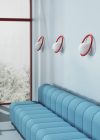 Hula Hoop wall lamp by Stefan Borselius featuring colorful ring around opaline glass globe for Swedish Ninja design