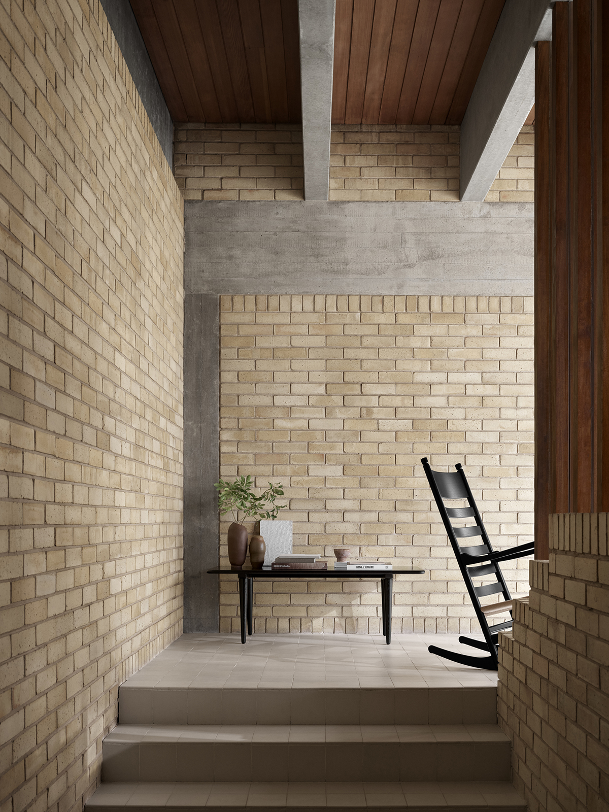 Hans J. Wegner rocking chair in black oak showcasing organic form and balanced proportions produced by Carl Hansen & Son