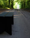 Stream bench by Monica Förster for SMD Design featuring geometric form with multiple angular planes
