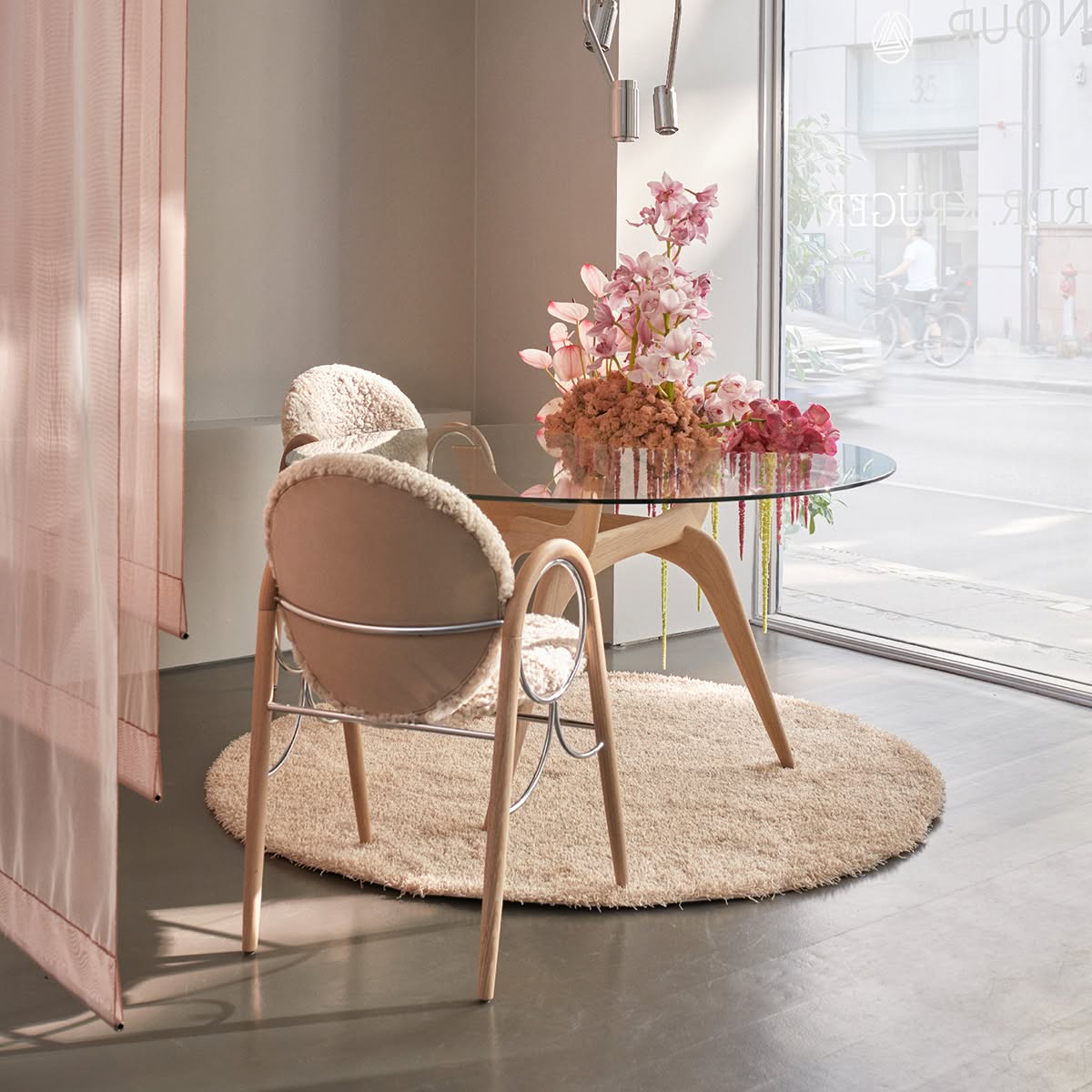 Anniversary edition of Nanna Ditzel's Arkade Chair by Brdr. Krüger featuring characteristic curved backrest