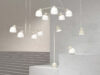 Bird lamp collection by Färg & Blanche for Belid featuring pendant, table, and floor variants in an exhibition setting