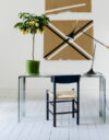 Børge Mogensen's iconic J39 chair by Fredericia displaying new artistic colorways alongside traditional natural finishes