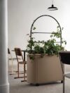 Hedge divider positioned to highlight its architectural presence and decorative quality characteristic of Kauppi & Kauppi's approach