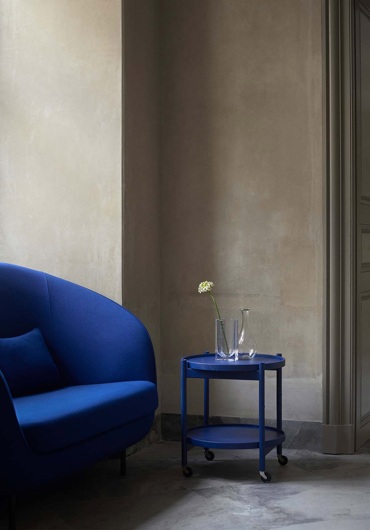 The indigo blue Tray Table designed by Hans Bølling in use at Designmuseum Danmark's café and lounge areas