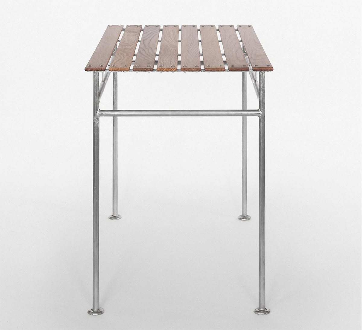 Modernist Stockholm Table with galvanized steel frame and natural wood top, designed for outdoor spaces