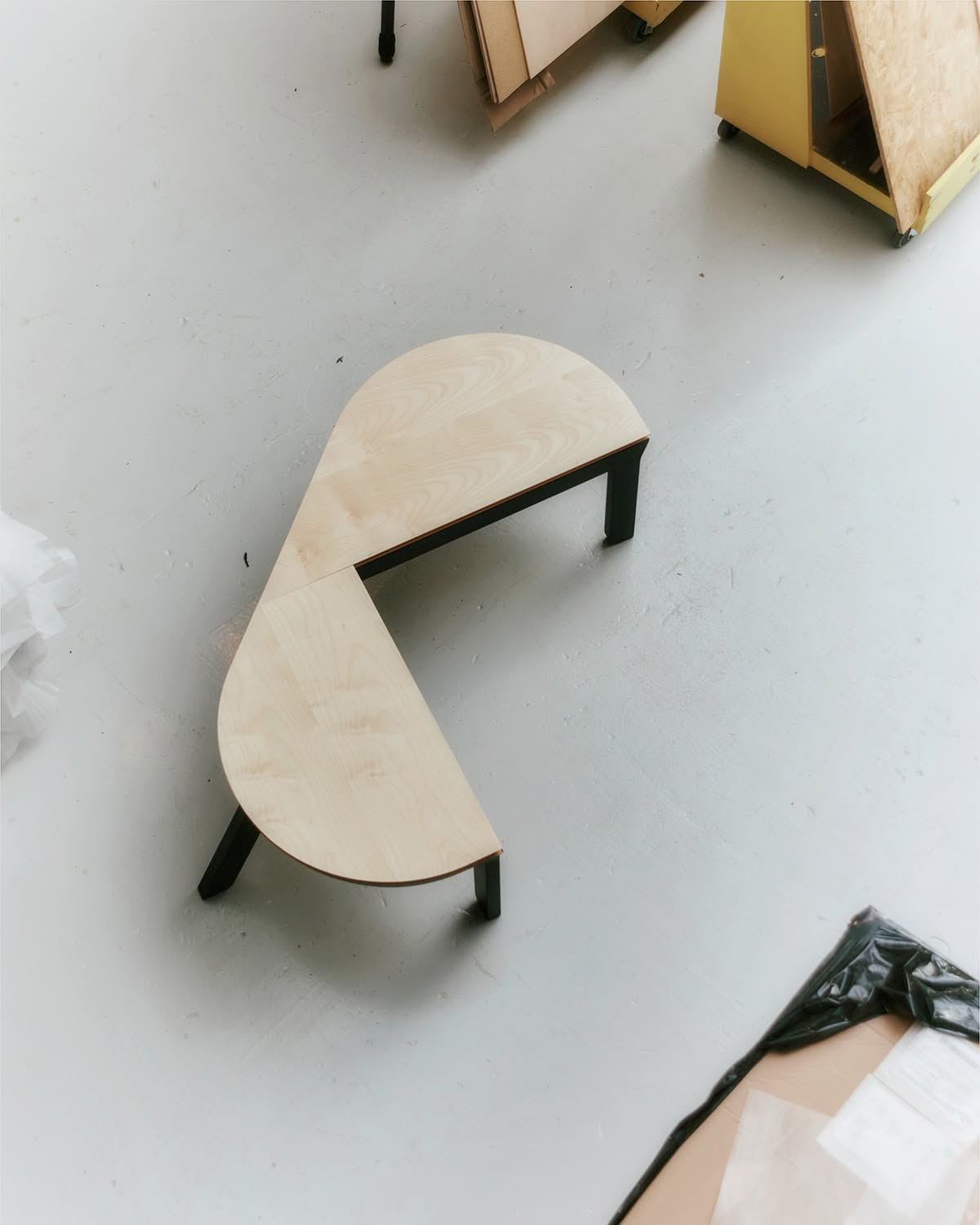 Danish workshop craftsmen assembling Nanna Ditzel bench using traditional woodworking techniques