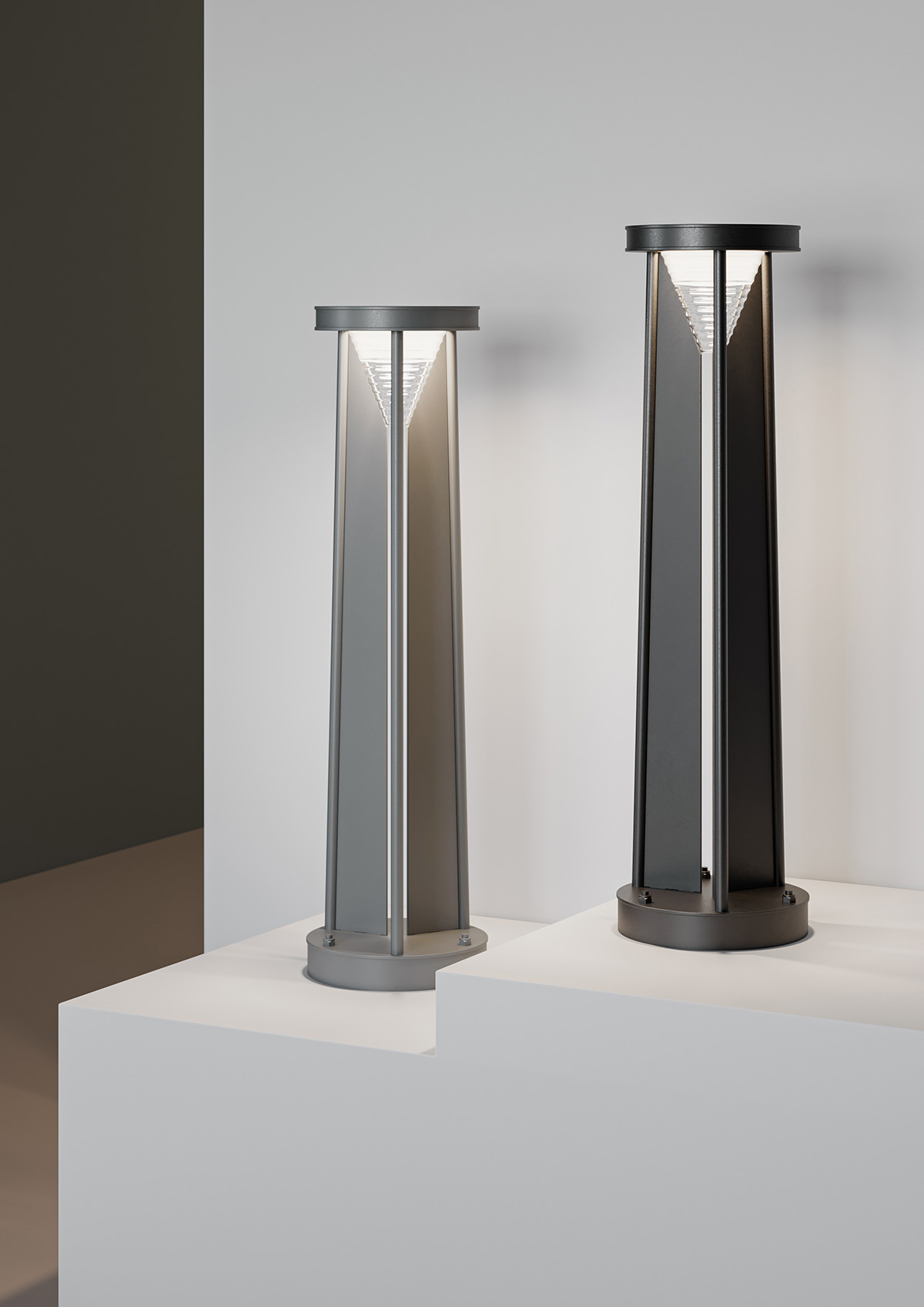 Triad luminaire close-up showing triangular construction and semi-transparent element.