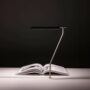 V is an adjustable lighting collection, which includes floor, wall-mounted, desk, clamp and grommet-mounted versions.