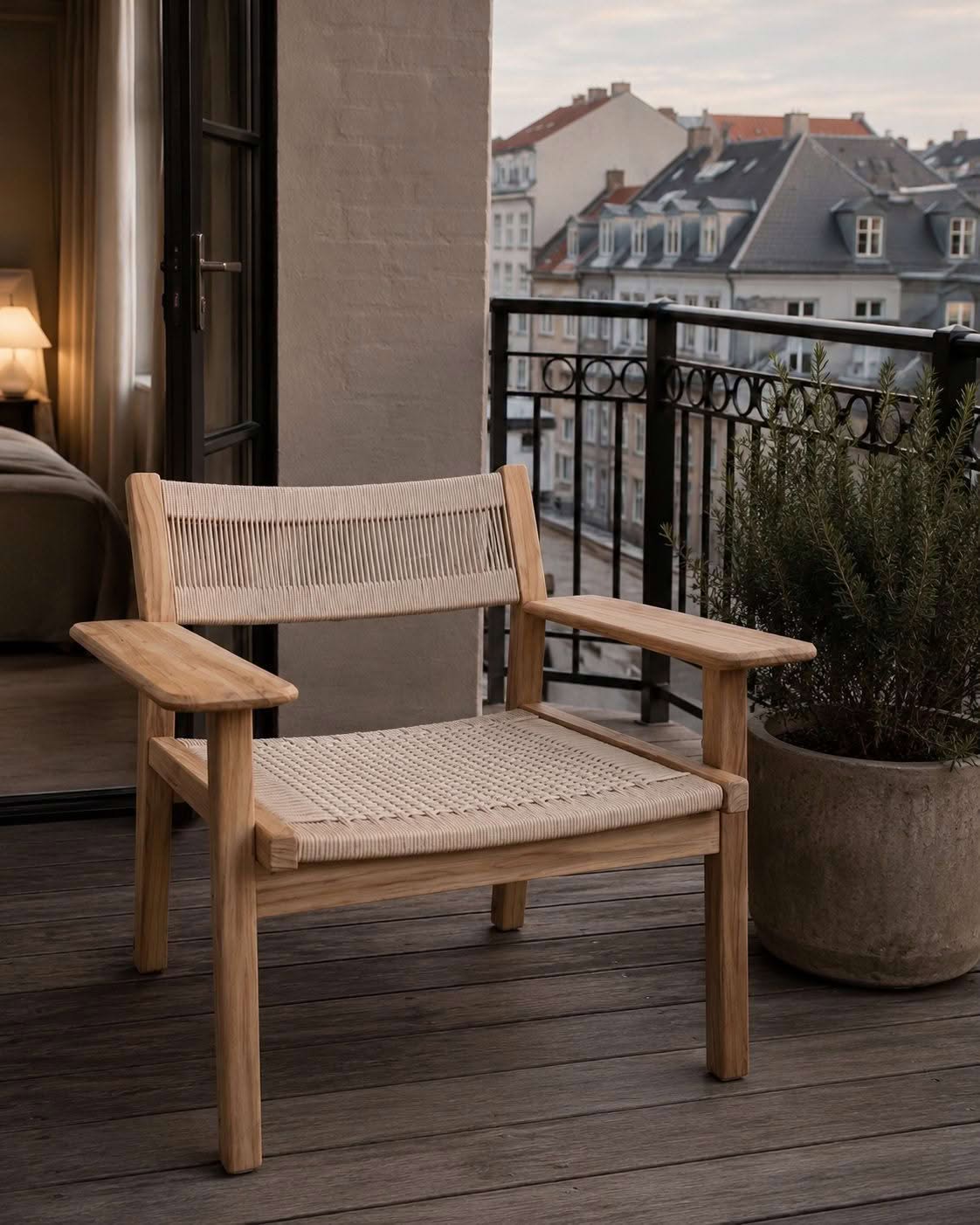 Skargaarden Djurö lounge chair in solid teak with hand-woven rope seat and backrest, shown in full profile